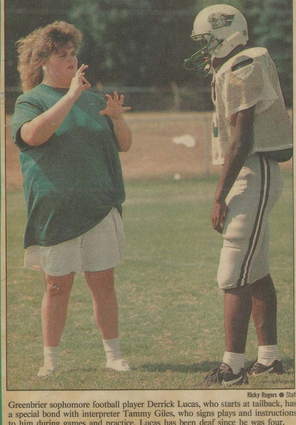 Derrick Lucas with interpreter Tammy Giles at Greenbrier football practice