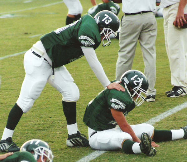 Two Greenbrier players sharing a field-level moment during Homecoming 2005