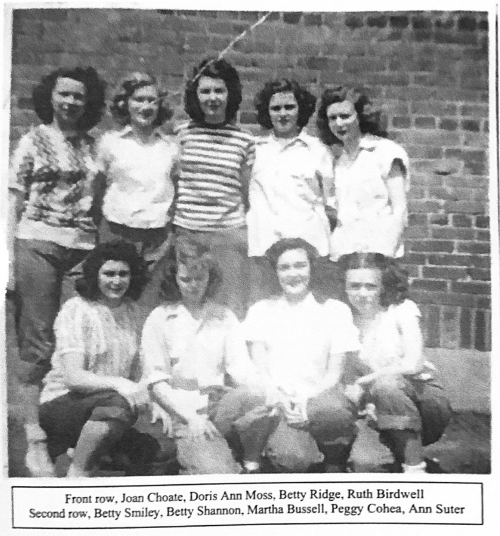 Undated group photograph with a printed caption naming Ann Suter in the second row